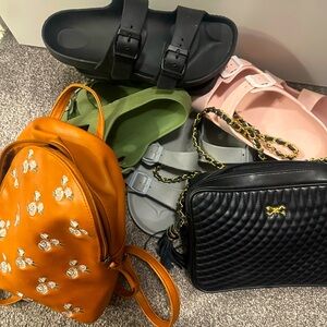 It’s a Bundle of 4 pairs of slides and cute brown back pack and black purse
